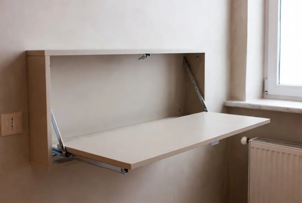 Fold-down wall desk demonstrating before and after setup in small bedroom workspace